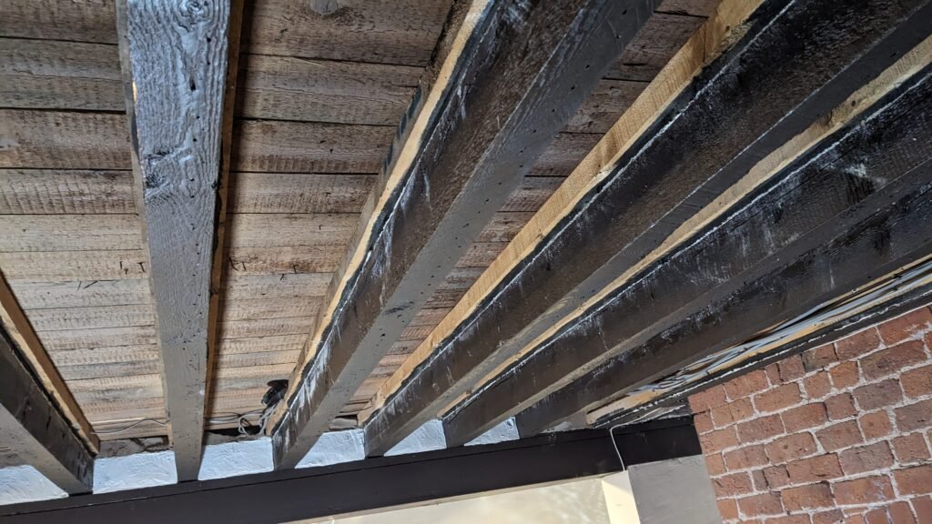 a photo of exposed ceiling joists in my lounge that I'm about to re-board