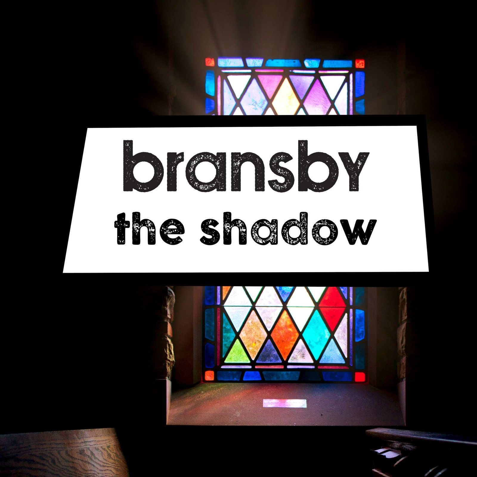 cover art for Bransby - The Shadow,shows light streaming through a colourful stained-glass window in church
